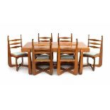 Amsterdamse SchoolAn impressive oak dining table and six ladder-back chairs with ebonised