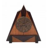 Amsterdamse SchoolA triangular oak and coromandel veneered table clock with moulded brass dial,