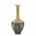 Royal DoultonA mainly green glazed stoneware vase with elongated neck, decorated with flower