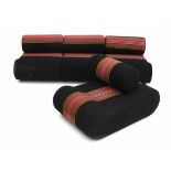 SeventiesFour modular seat elements of which one seat somewhat different, with cylindrical cushions,