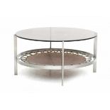 Jan Verhoeven (1931-2019)A circular metal coffee table with smoke glass top (chips) and leather