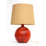 SeventiesA table lamp with orange glazed ceramic base and cream-coloured shade.69 cm. h. (total)