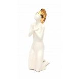 Joan Seyferth (1948)A white glazed ceramic figure of a kneeling lady with gilt hat, marked