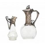 WMF (attributed)Two cut glass and pewter lidded jugs, with Jugendstil ornaments, unmarked, the