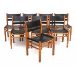 SeventiesA set of eight oak dining chairs with black sling leather seats and backrests.82 cm. h.