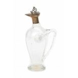 Arts & CraftsAn English silver and glass oil jug, designed as a stylized bird, the handle shaped