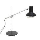 Midcentury ModernAn adjustable black and white lacquered and nickle plated metal desk lamp, in the