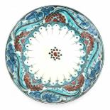 De Porceleyne Fles, DelftA Persian-inspired decorated ceramic wall plate, circa 1910-1930, signed to