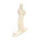 Eta Lempke (1909-1991)A white ceramic figure of a lady on skis, produced by Plateelbakkerij ZUid