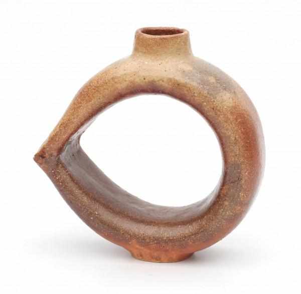 Japanese School, 20th CenturyA ring shaped, brown glazed stoneware Ikebana vase, marked underneath