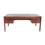 Søren WilladsenA Danish rosewood desk with four drawers and staggered legs, 1960s, marked with