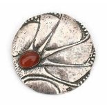 Cris Agterberg (1883-1948)A hammered silver brooch inset with cabochon cut carneole, circa 1930,