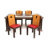 Hans van Bentem (1965)A tropical wooden veneered dining table with four chairs, the seats with red