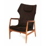 Ib Madsen & Acton SchubellA teak easy chair with brown upholstery and neck pillow, from the series