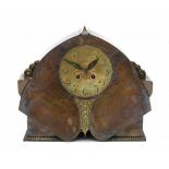 Amsterdamse SchoolA partly patinated copper and brass table clock, the dial and ornaments partlty
