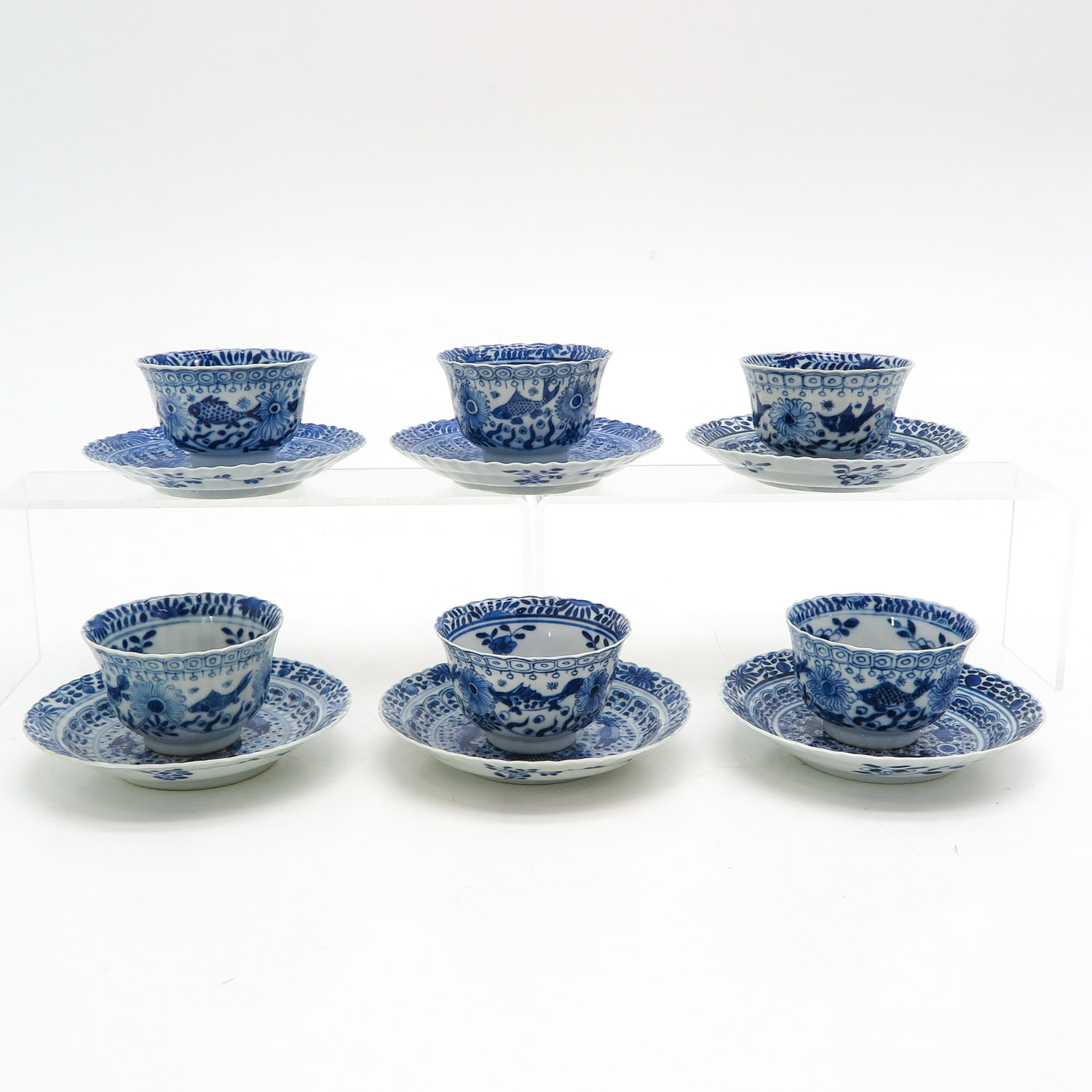 Six Blue and White Cups and Saucers