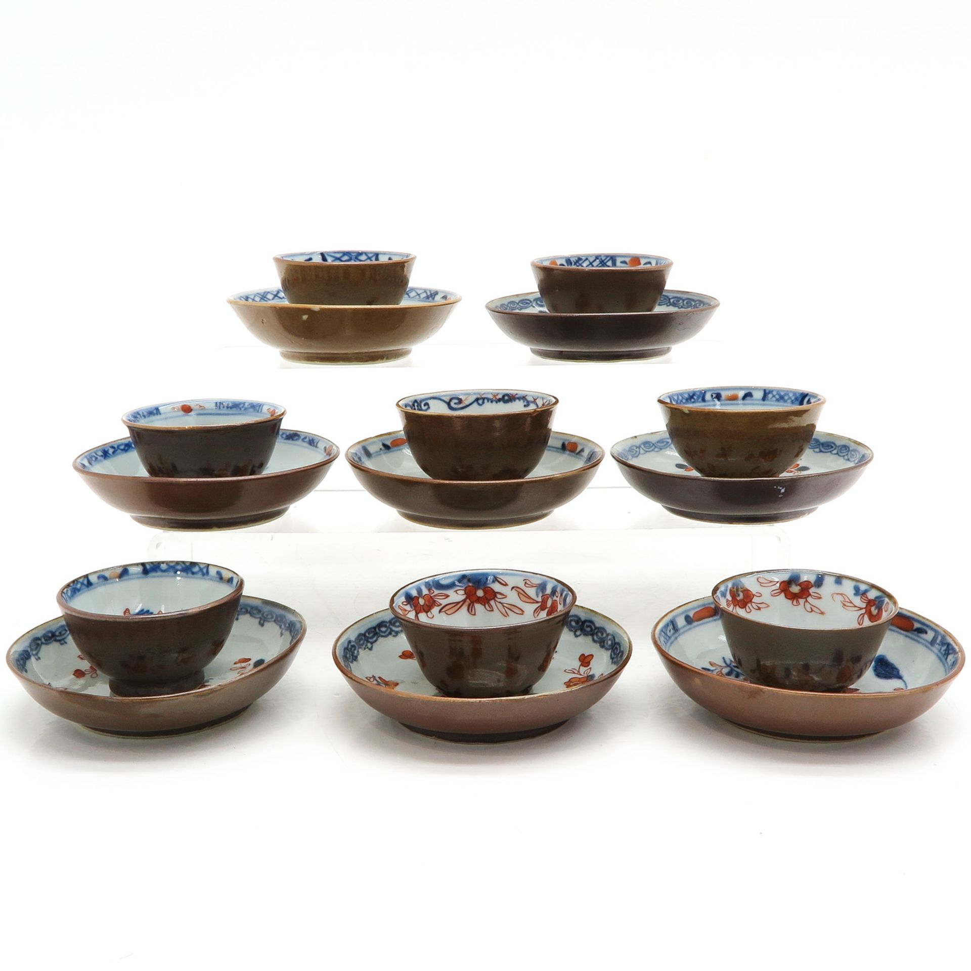 Eight Batavianware Cups and Saucers