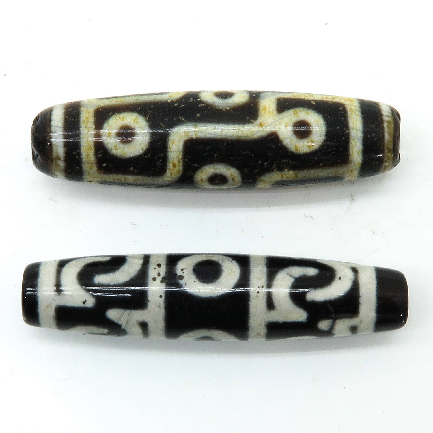 Two Dzi Dzi Beads