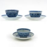 Three Blue and White Cups and Saucers