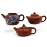 A Collection of 3 Yixing Teapots