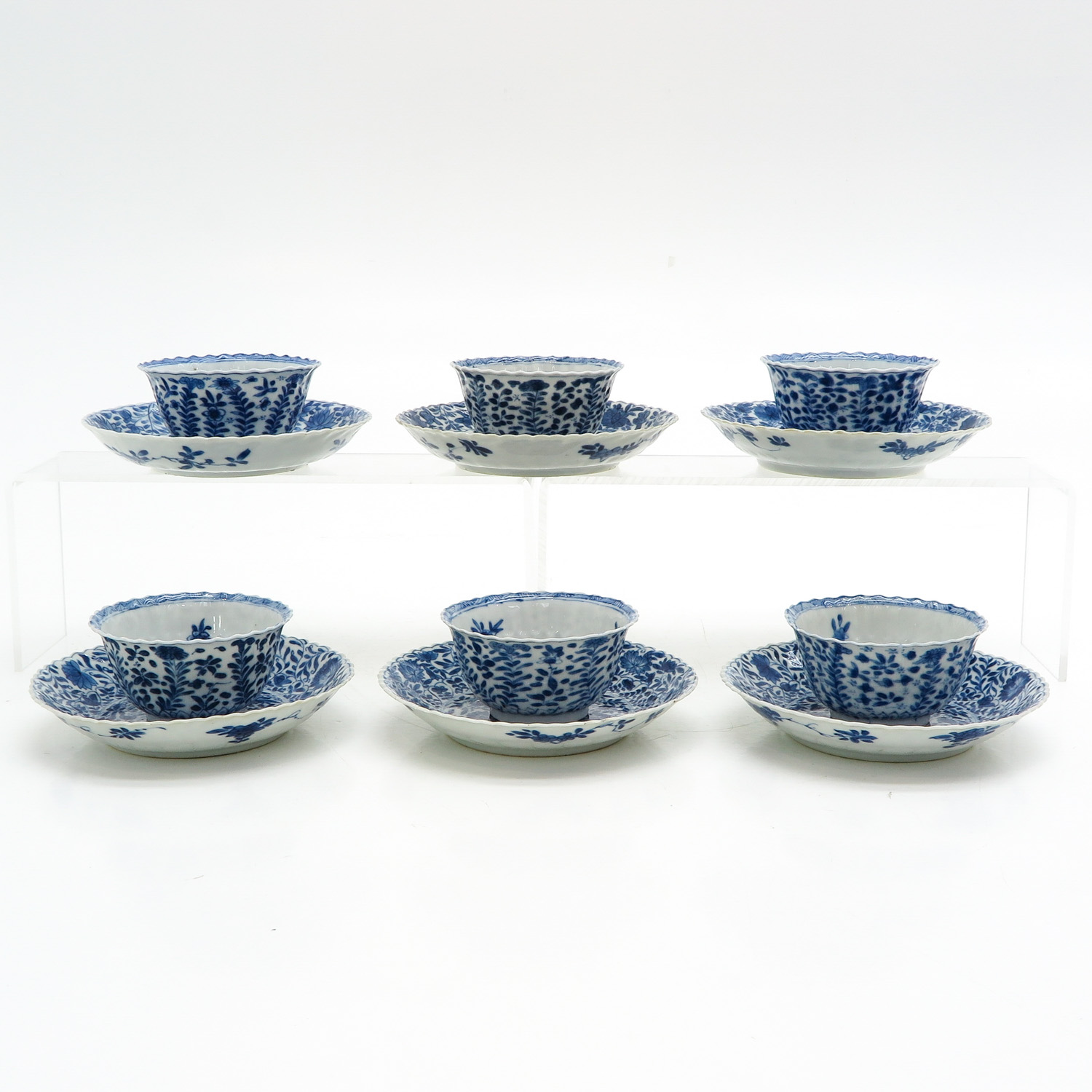 Six Blue and White Cups and Saucers