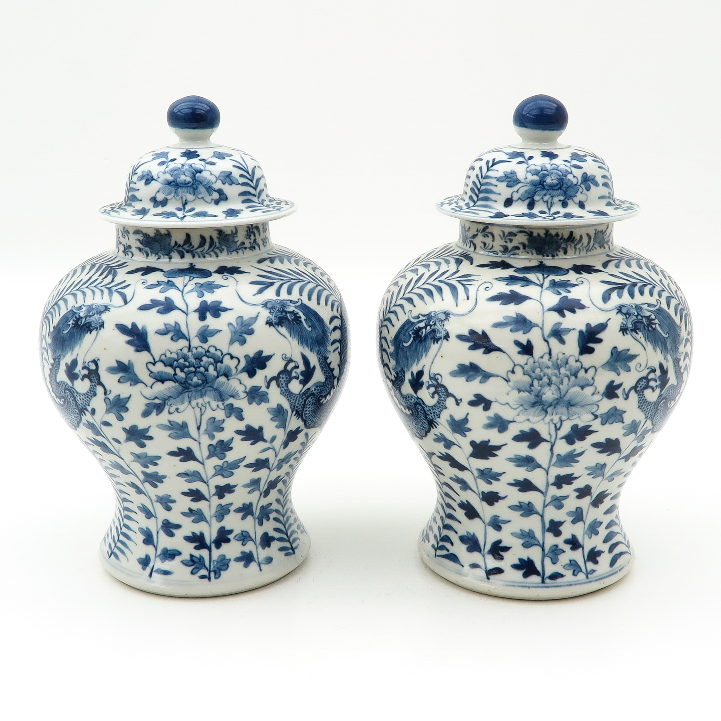 A Pair of Temple Jars with Covers
