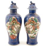 A Pair of Powder Blue and Gilt Vases with Cover