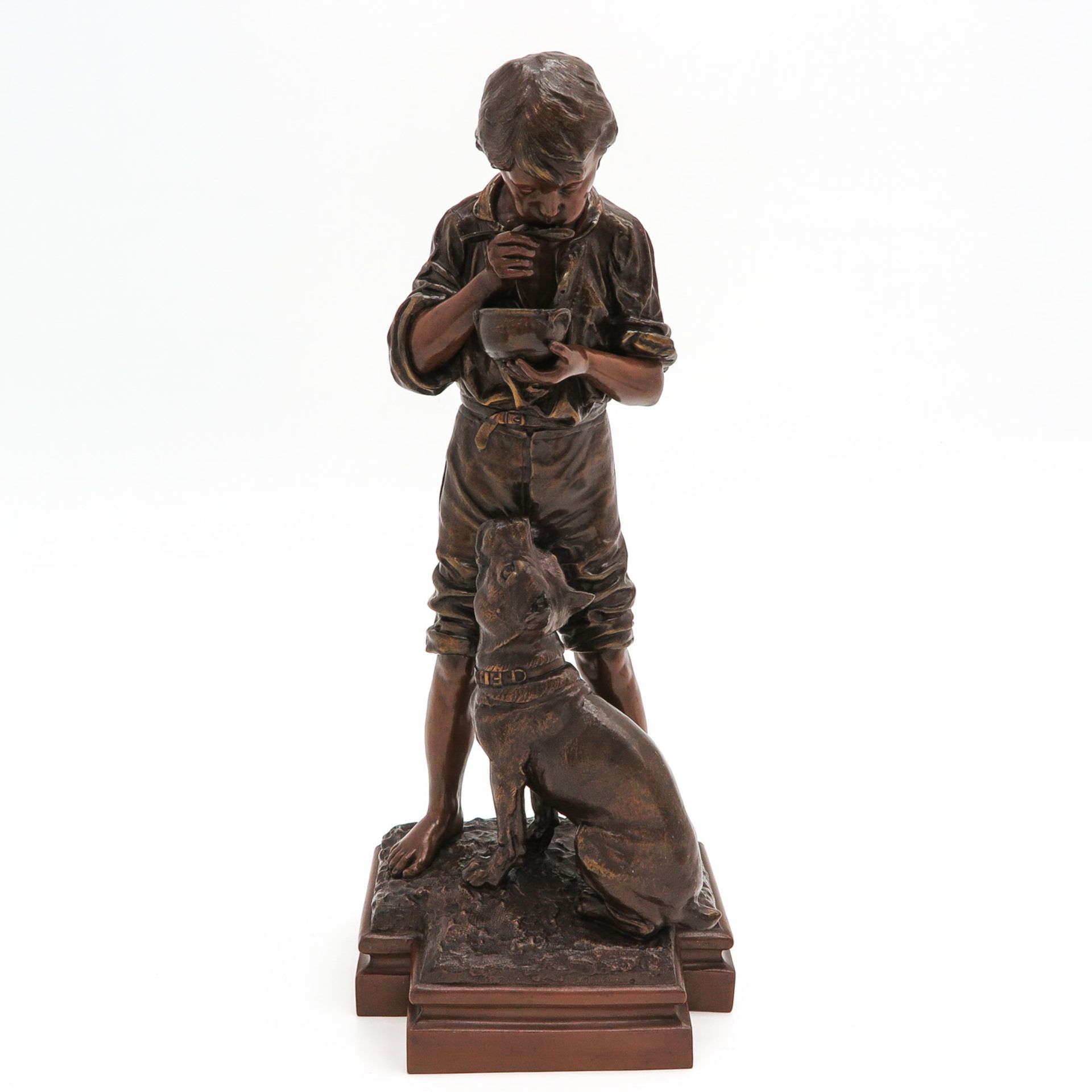 A Sculpture of Boy with Dog