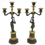 A Pair of 19th Century Empire Candelsticks