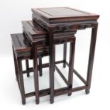 A Set of Three Carved Wood Nesting Tables