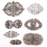 A Collection of Seven Silver Apron Clasps