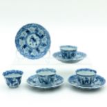 Four Blue and White Cups and Saucers