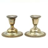 A Pair of Sterling Silver Candlesticks
