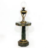 An Oil Lamp and Marble Table