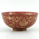 An Orange and Gilt Bowl