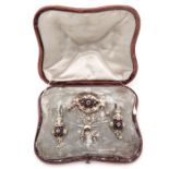 A 19th Century Brooch and Earrings in Foudraal