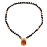 An Onyx and Jade Necklace