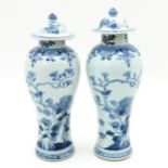 A Pair of Blue and White Covered Vases