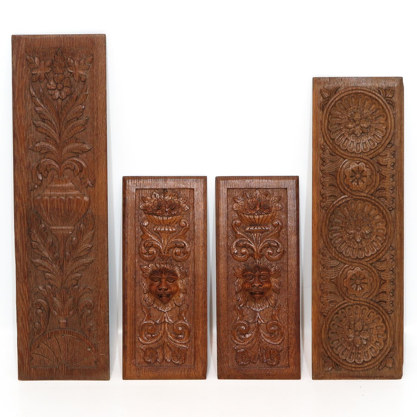 A Collection of Four Carved Oak Panels