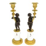 A Pair of 19th Century Empire Candlesticks