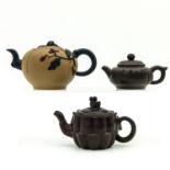 A Collection of 3 Yixing Teapots