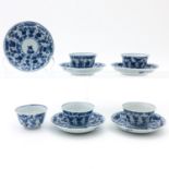 5 Blue and White Cups and Saucers