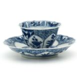 A Blue and White Cup and Saucer