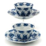 2 Blue and White Cups and Saucers