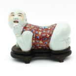 A Figural Chinese Pillow