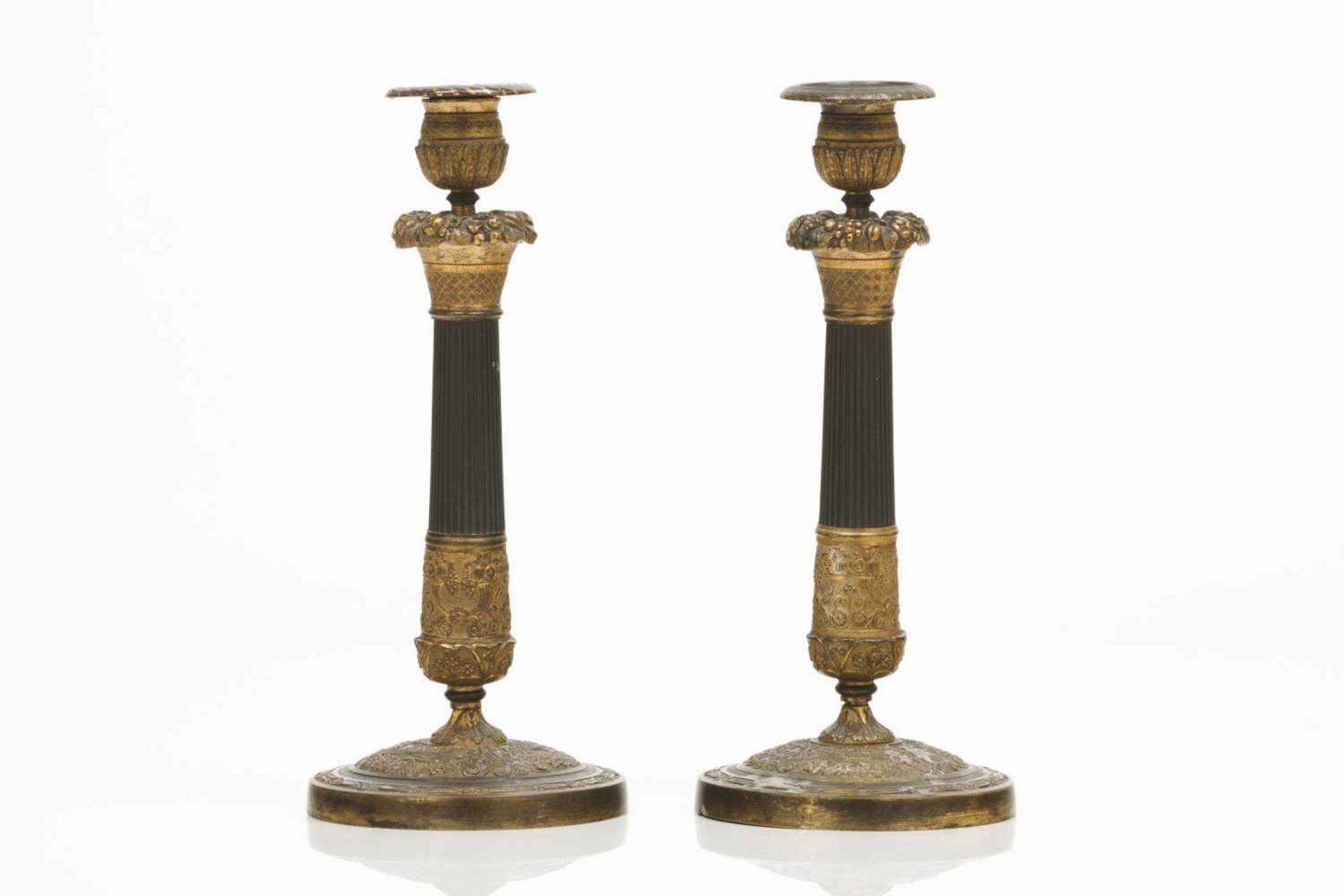 A pair of "Restoration" candlesticks