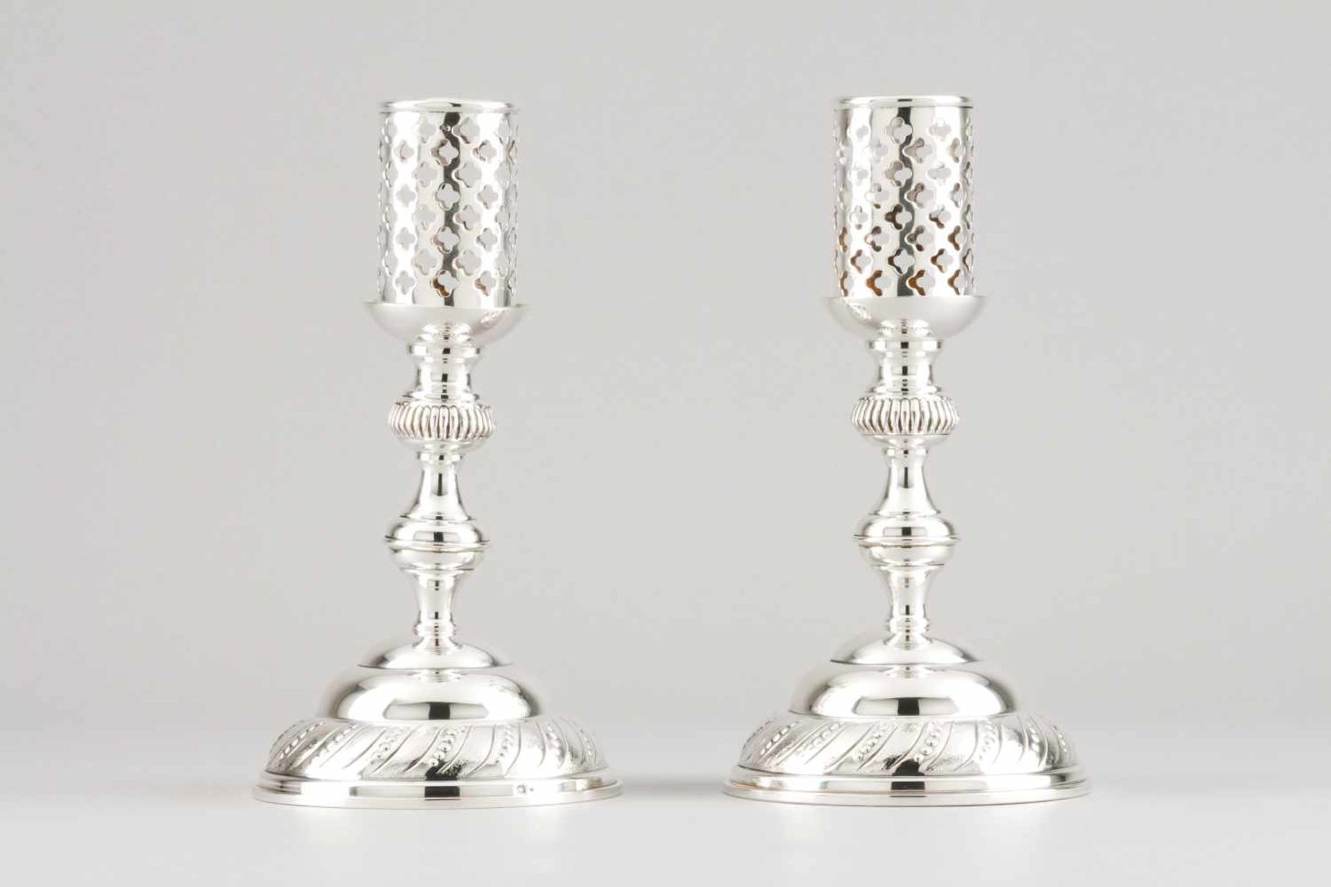 A pair of candle stands