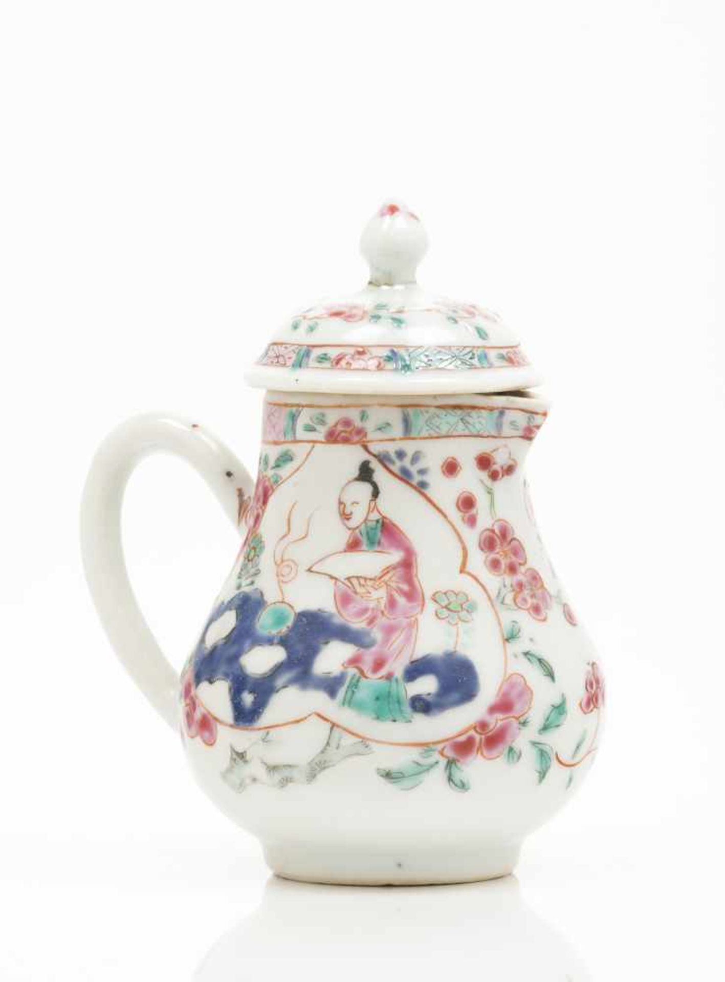 A small milk jug with cover