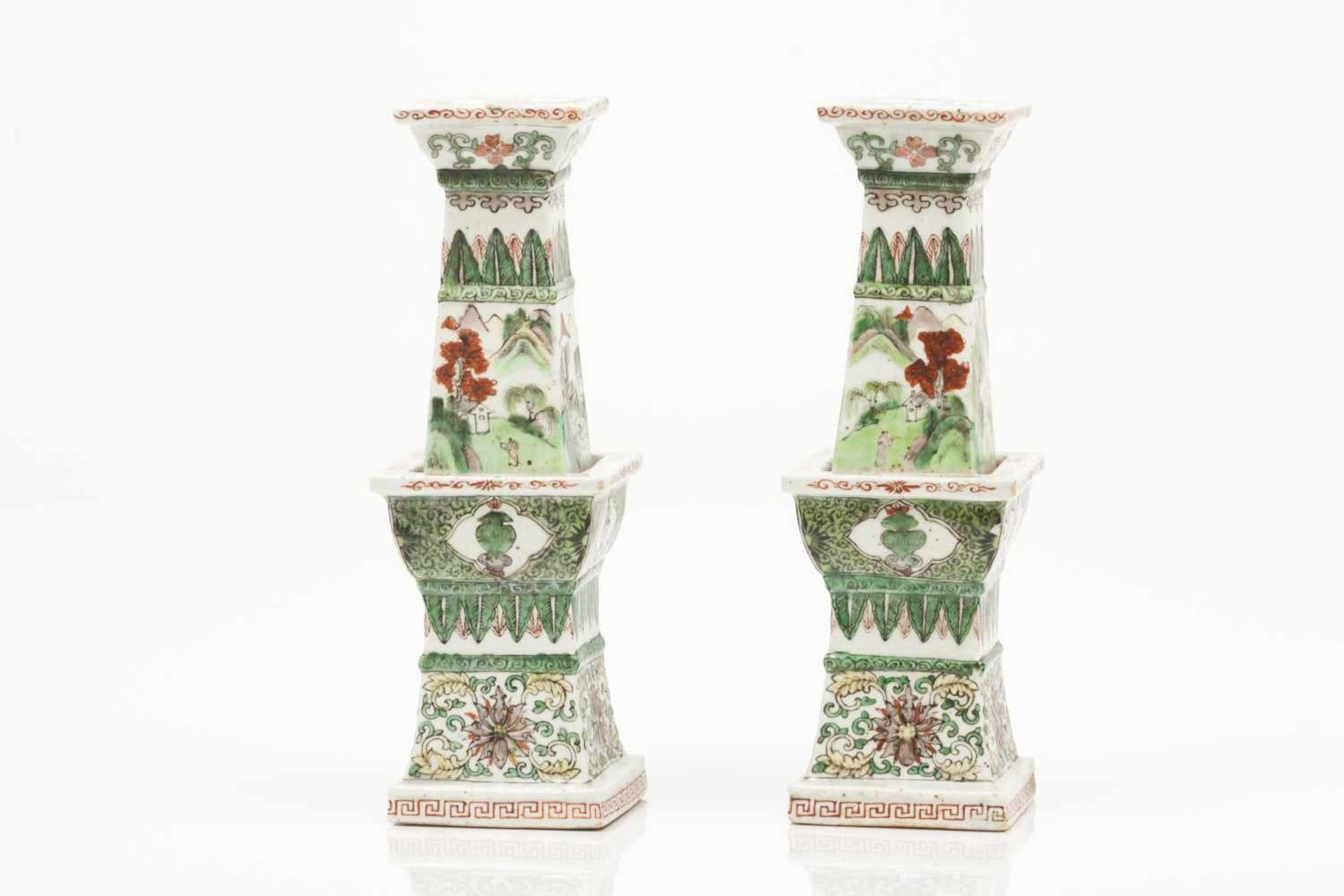A pair of incense burners/candle stands