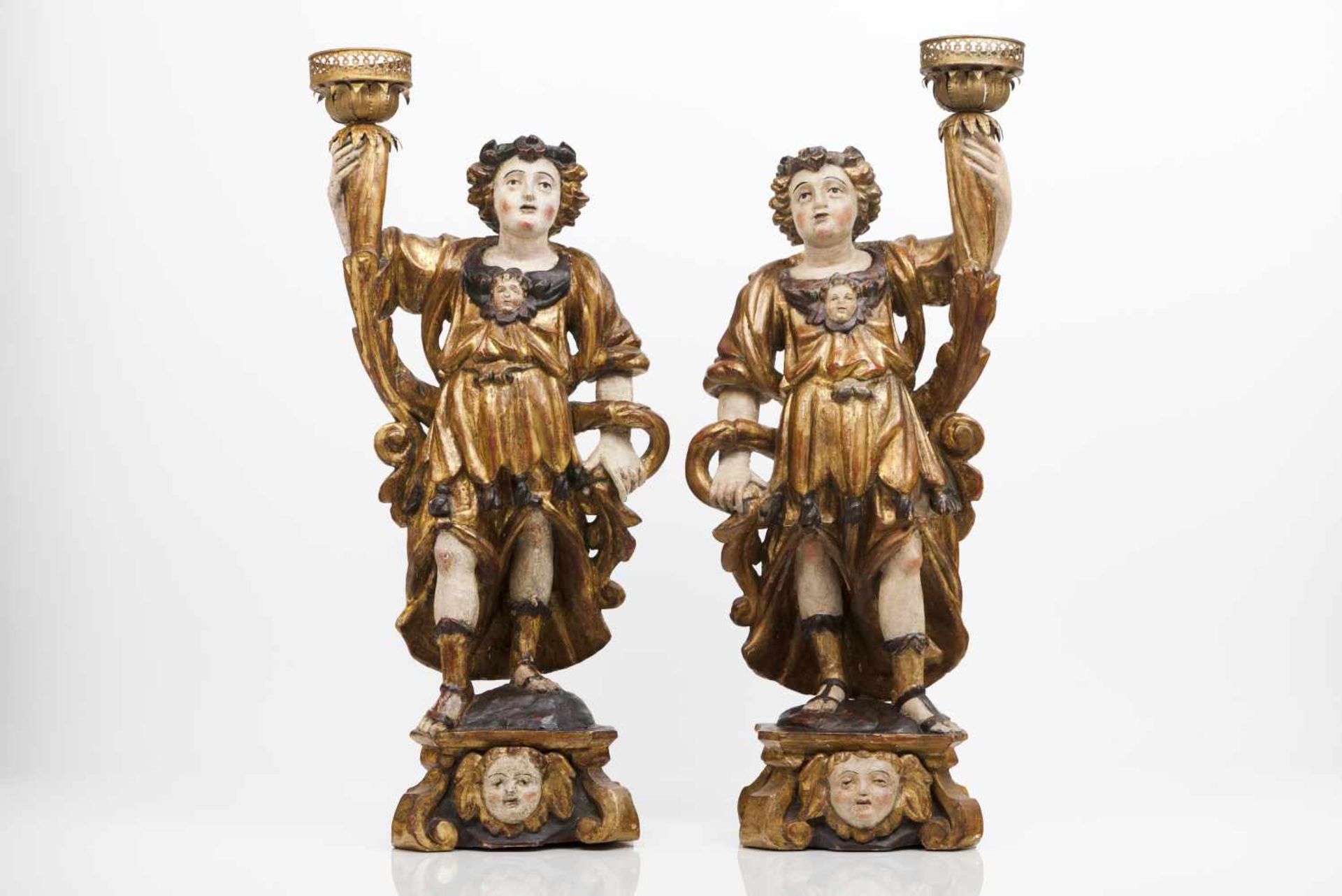 A pair of angels candleholdersCarved, gilt and polychrome wooden sculpturesPortugal, 18th c